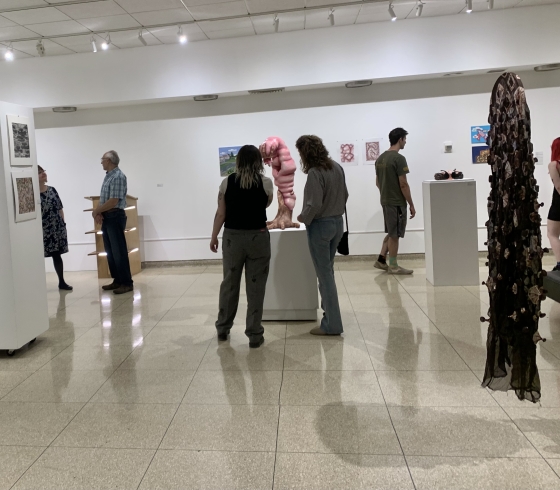 people viewing art in gallery