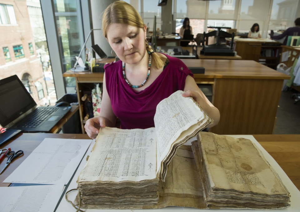 Katherine Beaty with a book at Harvard University