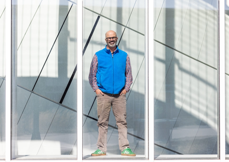 Jason Knight standing in front of a window