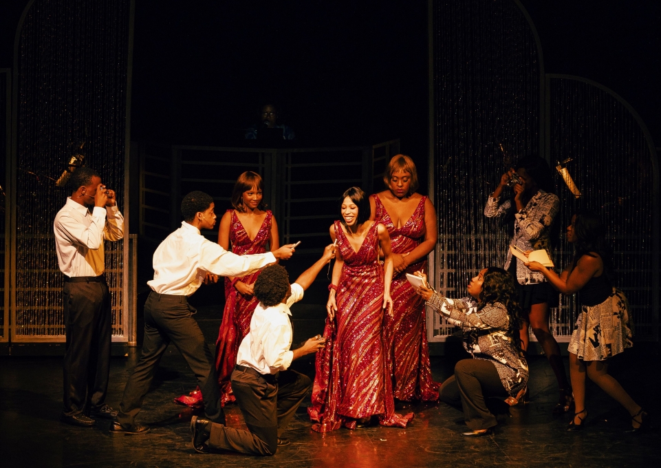 Cast members of Dreamgirls in a scene